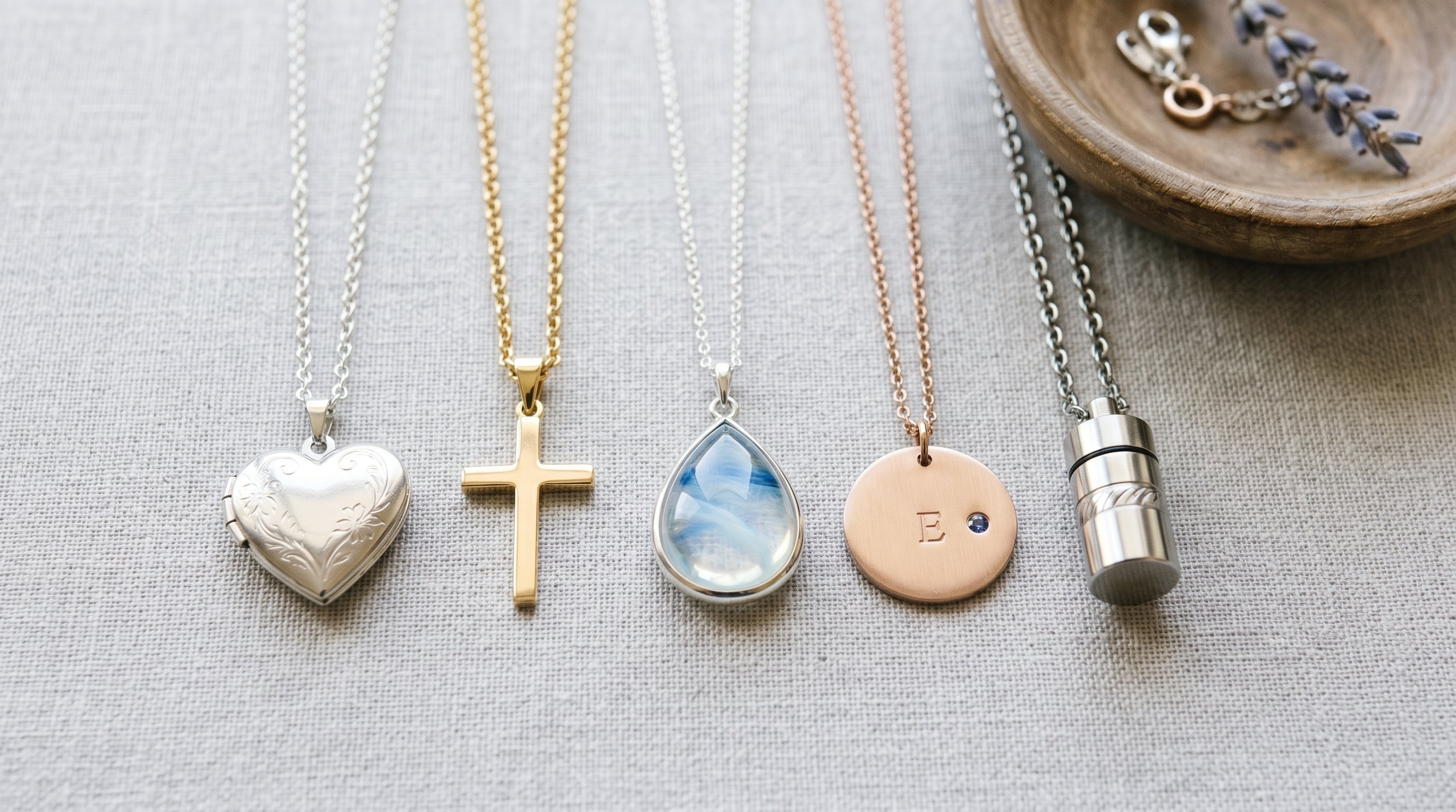 Different pendant keepsakes for ashes displayed together